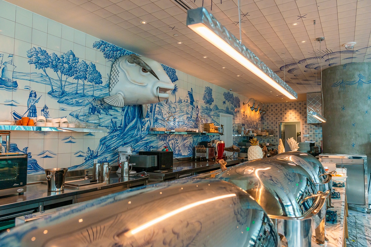 moody blue-toned restaurant photography with professional depth — commercial photography | ProShoot.io