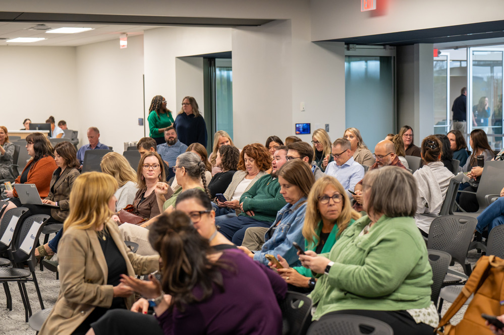Attendees take their seats before a conference session