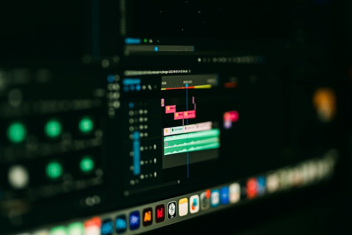 Professional video editor working on cinematic post-production timeline in editing suite — ProShoot.io