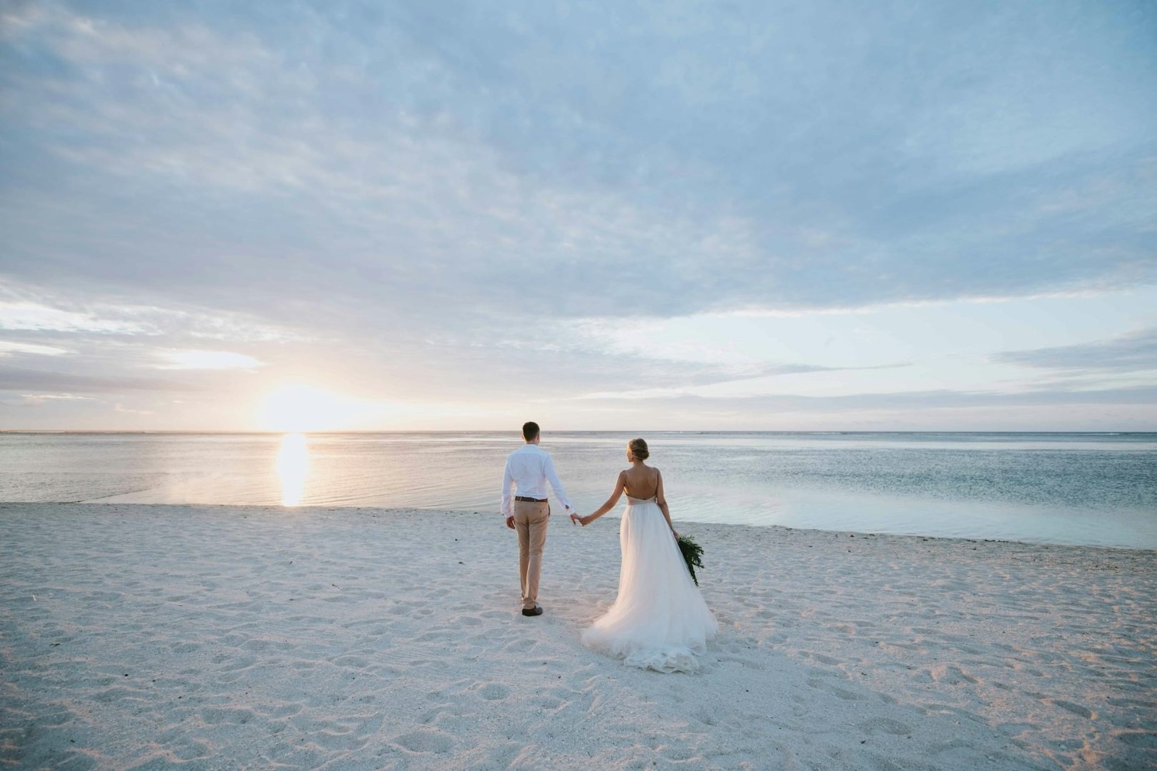 Professional wedding photographer capturing bride and groom at ceremony — ProShoot.io