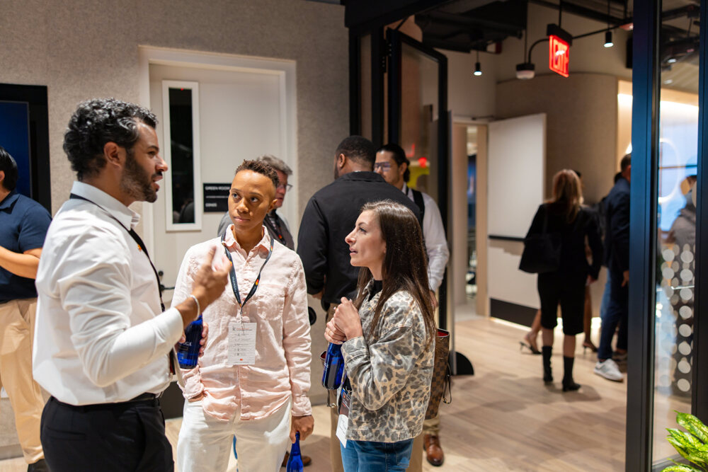Attendees talk between sessions at a business event